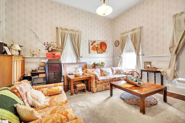 sitting room featuring a wainscoted wall, a decorative wall, carpet flooring, and wallpapered walls