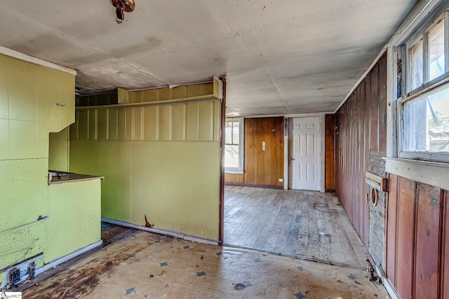 interior space featuring wooden walls and hardwood / wood-style flooring