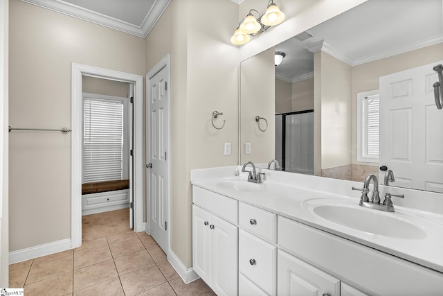 full bath with ornamental molding, tile patterned flooring, and a sink