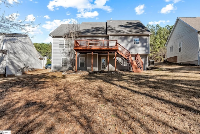 back of house featuring central AC, a yard, stairway, and a wooden deck