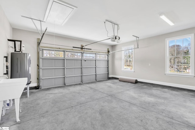 garage featuring water heater, baseboards, and a garage door opener