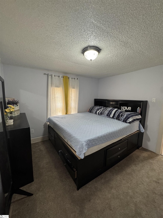 carpeted bedroom with a textured ceiling