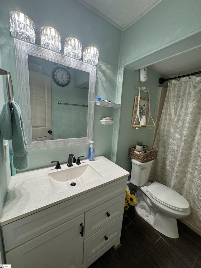 bathroom featuring vanity, toilet, and wood finished floors