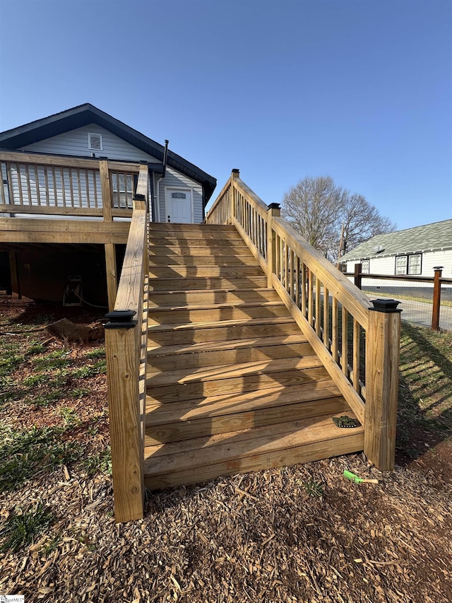 exterior space with a deck and stairway