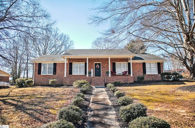 ranch-style home with brick siding and a porch