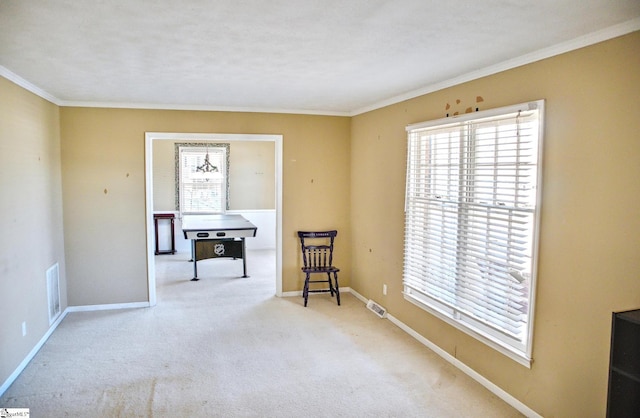 sitting room featuring ornamental molding, visible vents, carpet floors, and baseboards