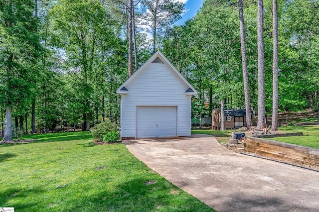 detached garage with concrete driveway