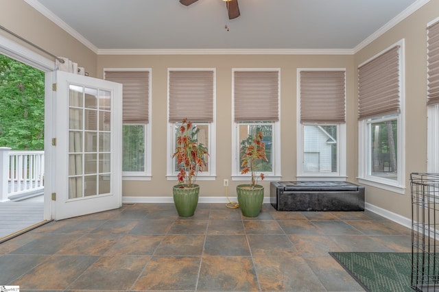 unfurnished sunroom featuring plenty of natural light and ceiling fan