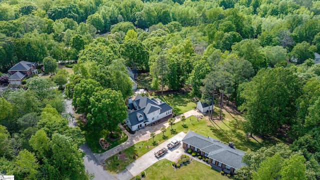 aerial view featuring a view of trees