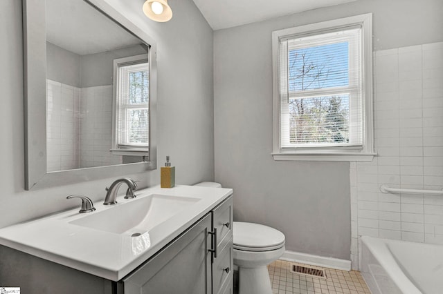 full bath featuring toilet, vanity, visible vents, baseboards, and tile patterned floors