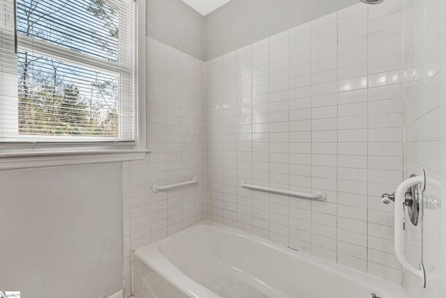 full bathroom with a shower and a washtub