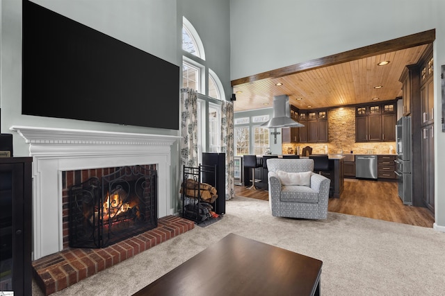 103 Hornbuckle Dr, Easley, SC 29642 - carpeted living room featuring a fireplace, recessed lighting, a high ceiling, wood finished floors, and wooden ceiling