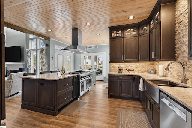 103 Hornbuckle Dr, Easley, SC 29642 - kitchen featuring appliances with stainless steel finishes, dark brown cabinetry, a sink, and island range hood