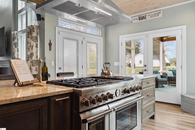 103 Hornbuckle Dr, Easley, SC 29642 - kitchen featuring light stone counters, french doors, light wood-style flooring, ventilation hood, and double oven range