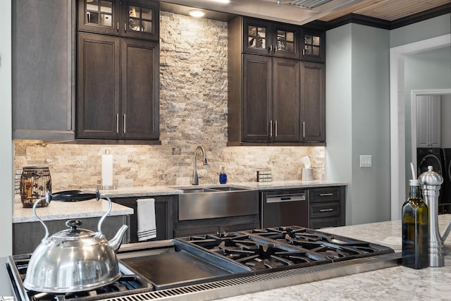 103 Hornbuckle Dr, Easley, SC 29642 - kitchen with dishwashing machine, dark brown cabinets, backsplash, and light stone counters