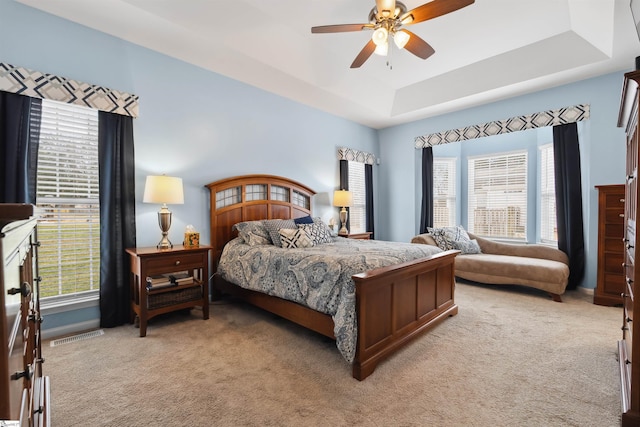 103 Hornbuckle Dr, Easley, SC 29642 - bedroom featuring a ceiling fan, a raised ceiling, light carpet, and visible vents