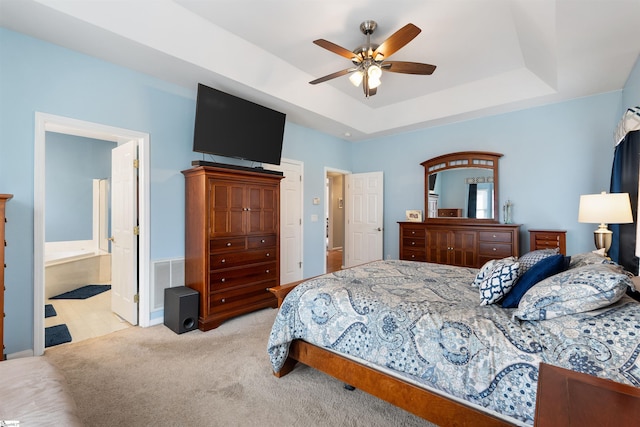 103 Hornbuckle Dr, Easley, SC 29642 - bedroom featuring ceiling fan, light colored carpet, visible vents, a tray ceiling, and ensuite bath