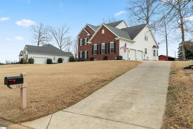 103 Hornbuckle Dr, Easley, SC 29642 - view of front of home featuring a front lawn, brick siding, driveway, and an attached garage
