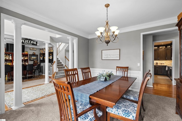 103 Hornbuckle Dr, Easley, SC 29642 - dining room with a chandelier, stairs, wainscoting, decorative columns, and crown molding