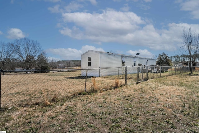 view of home's exterior with fence