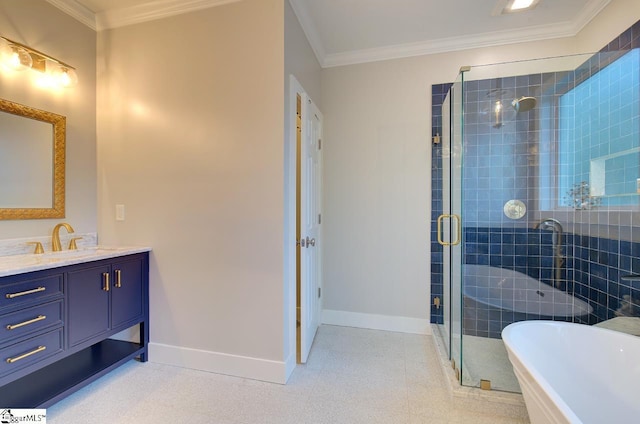 full bathroom featuring a freestanding tub, vanity, baseboards, ornamental molding, and a stall shower