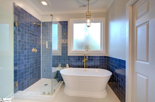 full bath with crown molding, a soaking tub, visible vents, and a tile shower