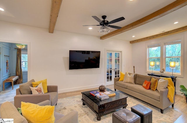 living room with baseboards, french doors, light wood-type flooring, beam ceiling, and recessed lighting