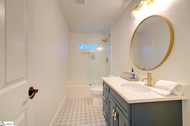 bathroom with bathtub / shower combination, toilet, vanity, baseboards, and tile patterned floors