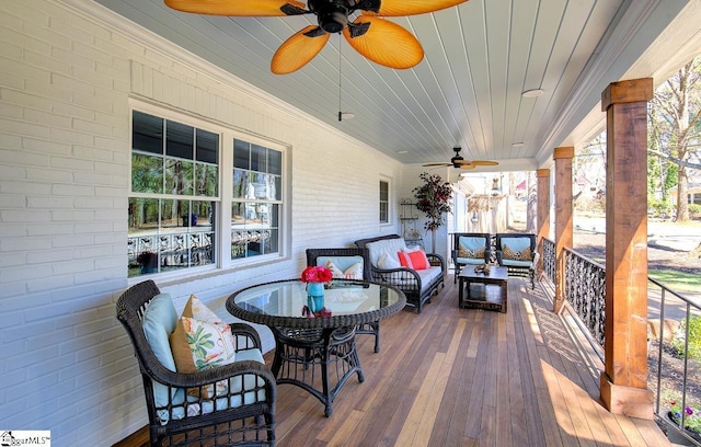 deck featuring outdoor lounge area and a ceiling fan