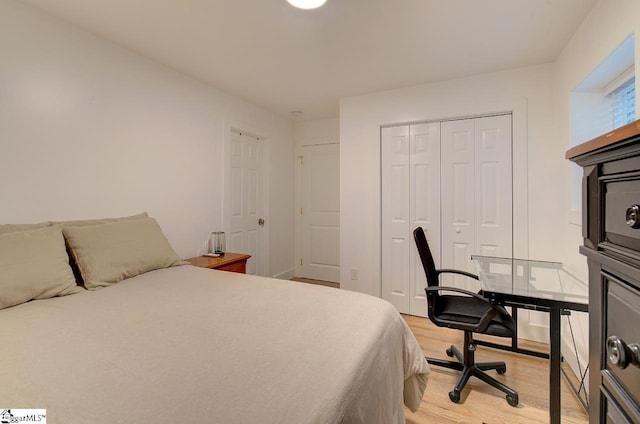 bedroom with a closet and light wood-type flooring