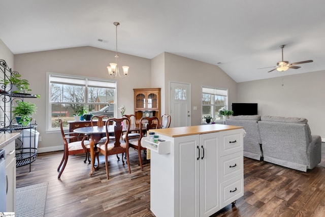 kitchen with dark wood-style floors, plenty of natural light, and vaulted ceiling