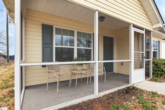 view of exterior entry featuring a porch