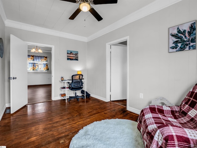 living area with baseboards, ornamental molding, hardwood / wood-style floors, and ceiling fan with notable chandelier