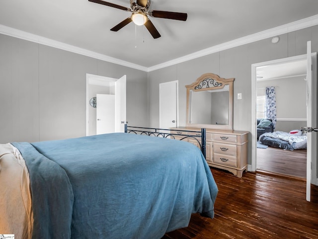 bedroom with dark wood finished floors, crown molding, and ceiling fan