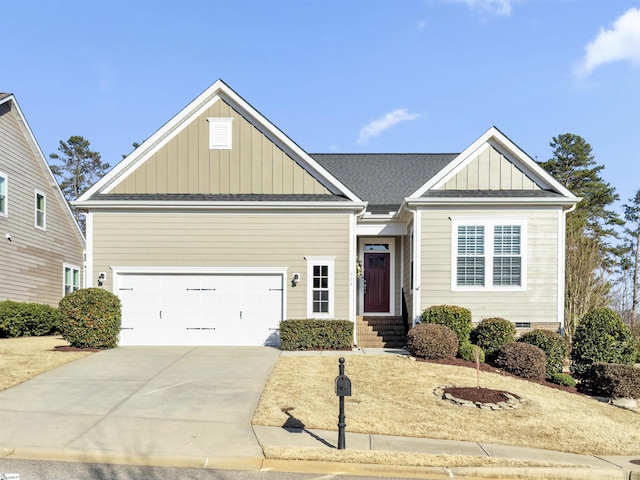view of front of house with concrete driveway, a garage, board and batten siding, and roof with shingles