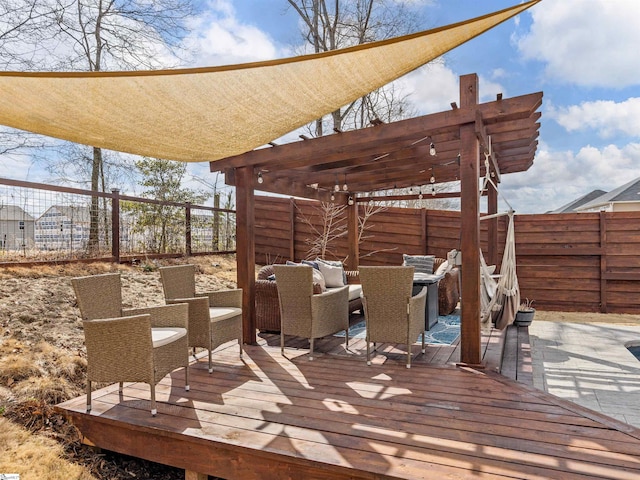 wooden deck with a pergola, a fenced backyard, and an outdoor hangout area