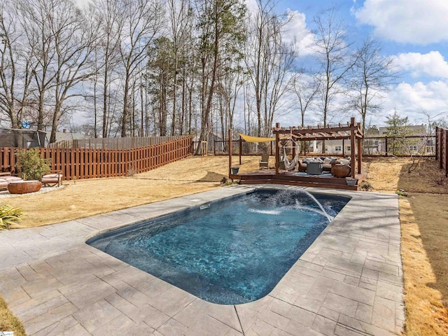 view of swimming pool featuring a fenced backyard, a patio, a deck, and a pergola
