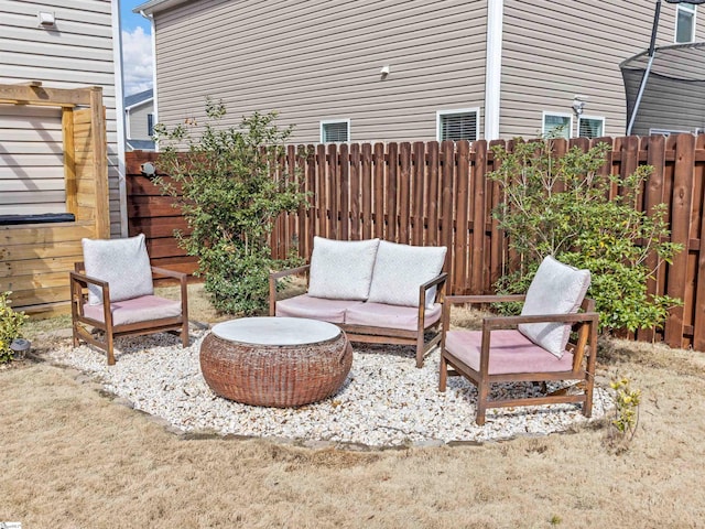 view of patio / terrace featuring an outdoor hangout area and a fenced backyard