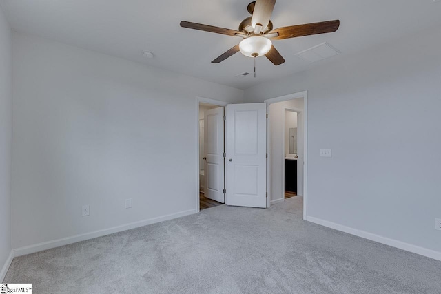 unfurnished bedroom with ceiling fan, carpet floors, and baseboards