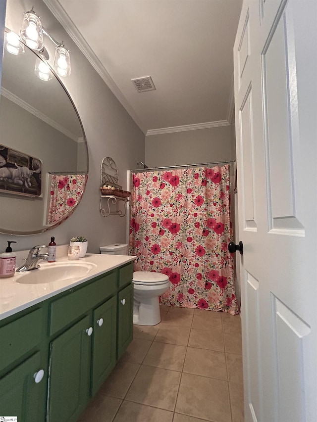 bathroom featuring toilet, vanity, visible vents, tile patterned floors, and crown molding