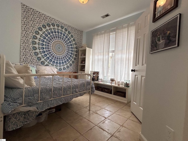 bedroom featuring visible vents and tile patterned floors