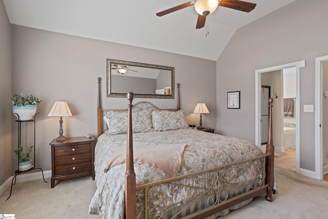 carpeted bedroom with lofted ceiling, connected bathroom, a ceiling fan, and baseboards