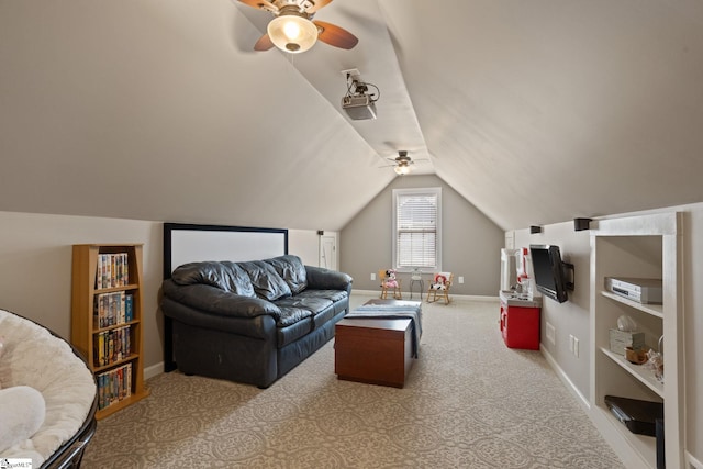 living room with lofted ceiling, a ceiling fan, baseboards, and carpet flooring