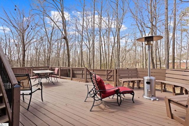 wooden terrace with outdoor dining space