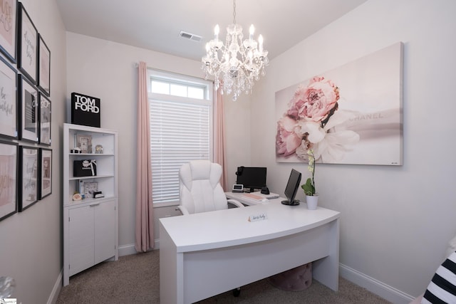 office space featuring carpet floors, visible vents, a notable chandelier, and baseboards