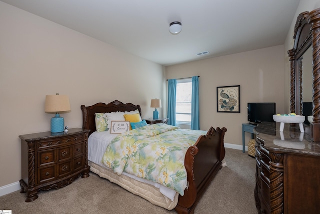 bedroom featuring carpet, visible vents, and baseboards