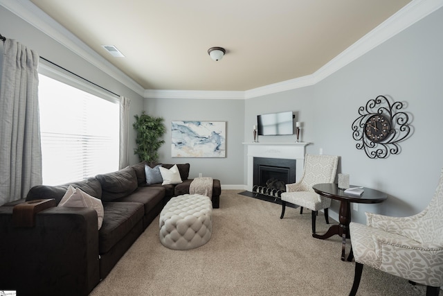 living area featuring crown molding, visible vents, carpet flooring, and a fireplace with flush hearth