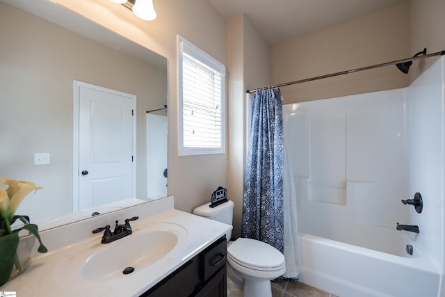 bathroom featuring shower / bath combo, vanity, toilet, and tile patterned floors