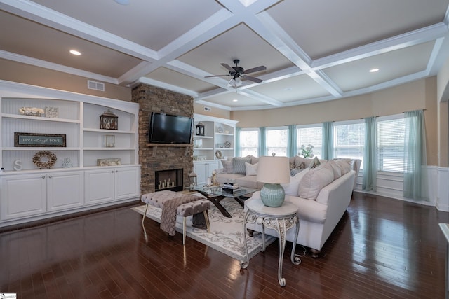 living room featuring dark wood-style floors, a wealth of natural light, and coffered ceiling