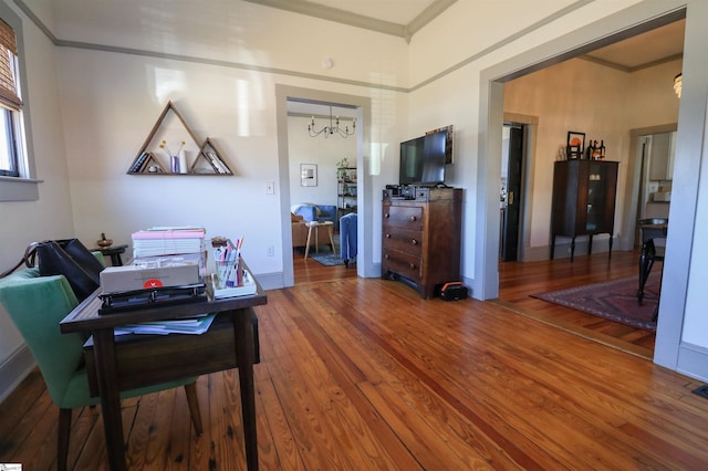 office with a chandelier, baseboards, hardwood / wood-style flooring, and crown molding